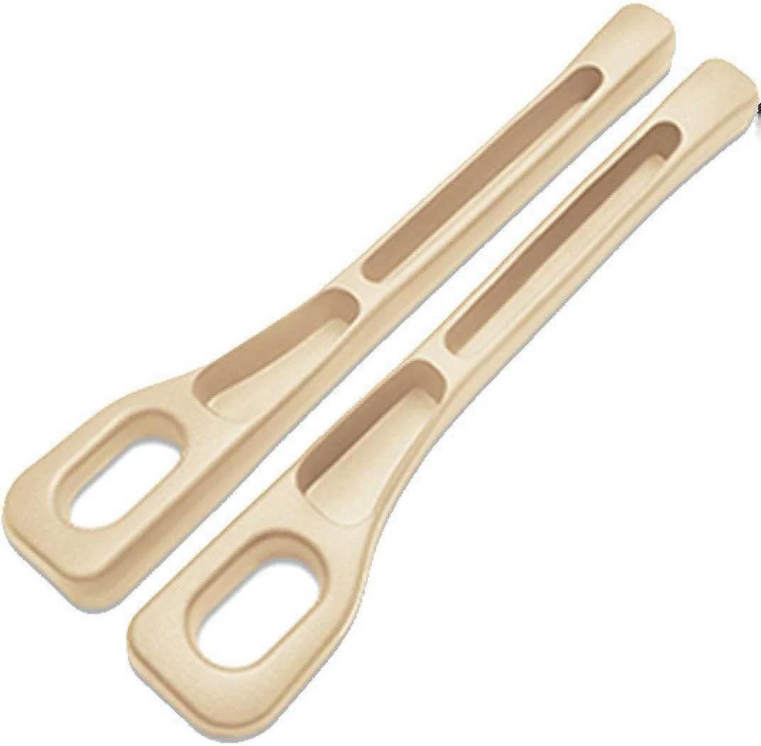 Close-up of a beige pair of car seat gap organizers