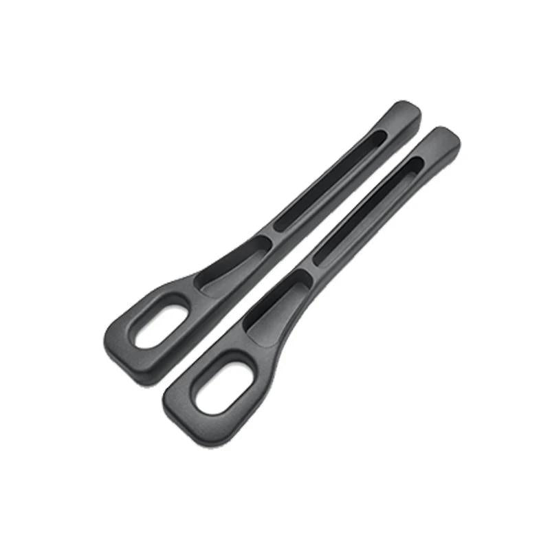 Black pair of dual-slot car seat gap organizers on a white background