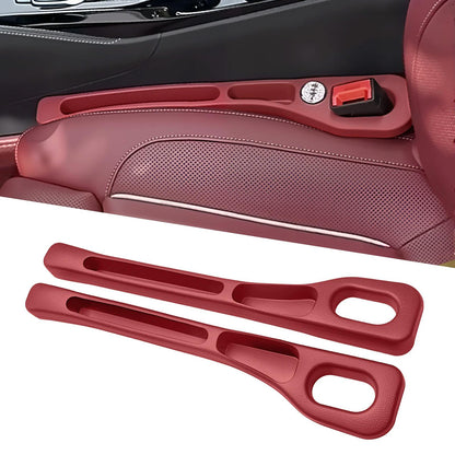 Red seat gap organizer installed beside a seat with a matching pair shown below