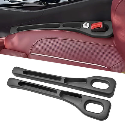 Black seat gap organizer installed beside a seat with a matching pair shown below