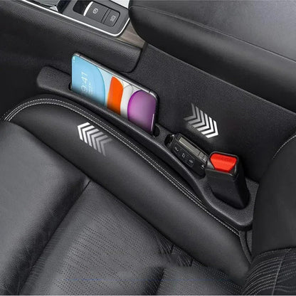 Black dual-slot seat gap organizer holding a phone and small accessories